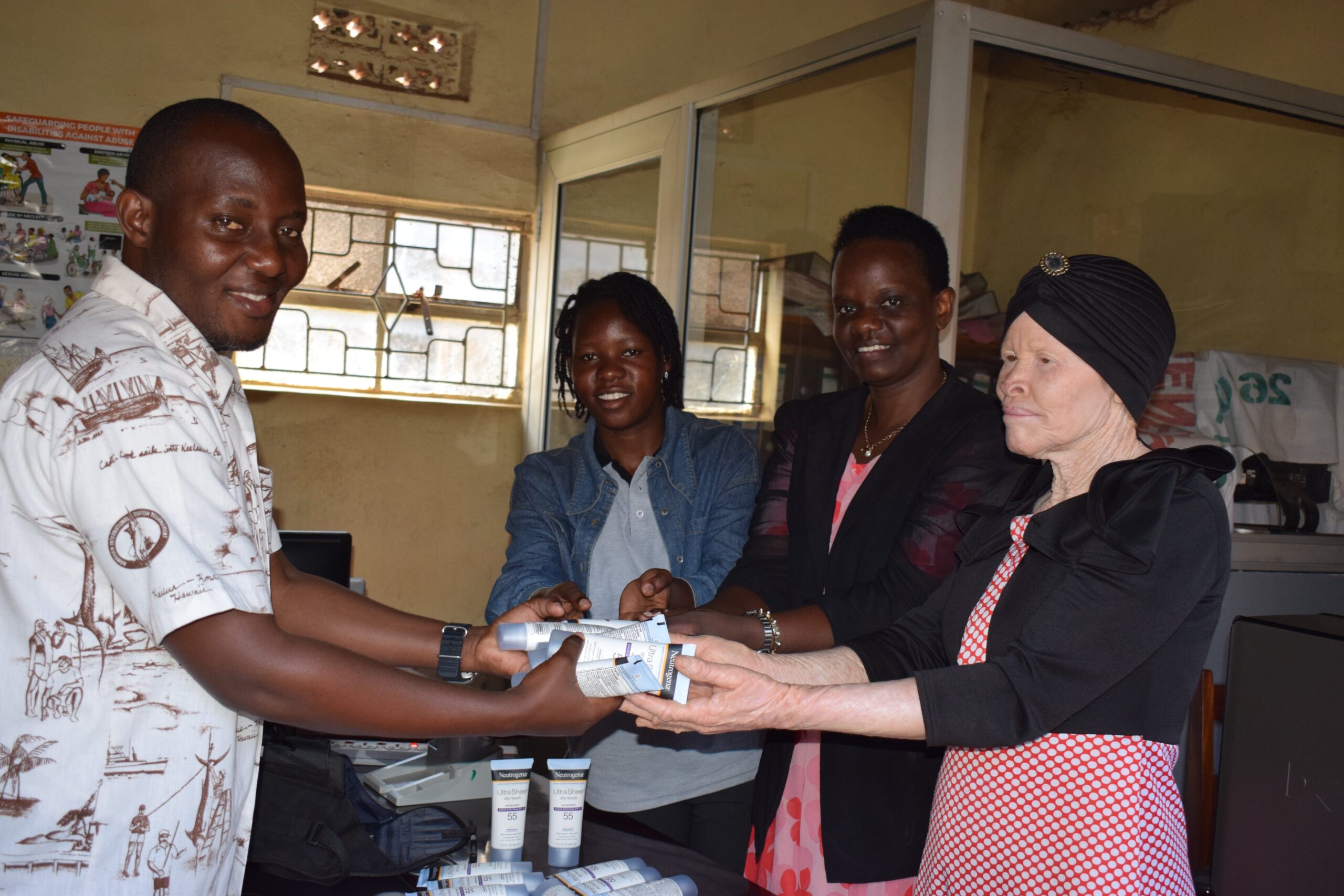 WAA distributing sunscreen to persons with albinism in Iganga