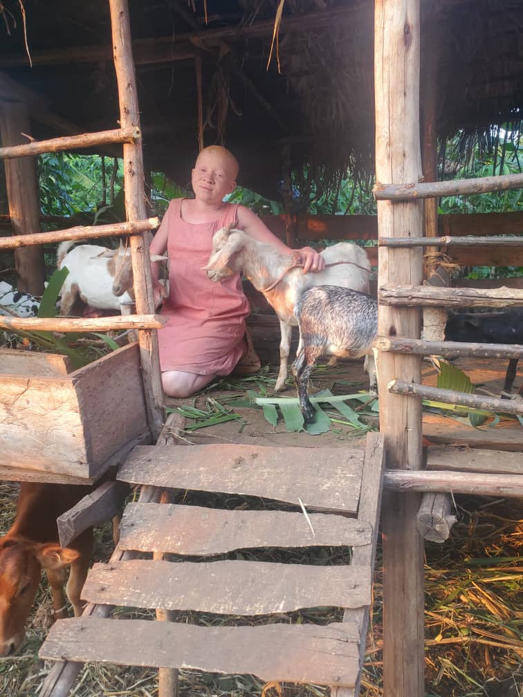 Woman with albinism running a small livestock farm in Uganda